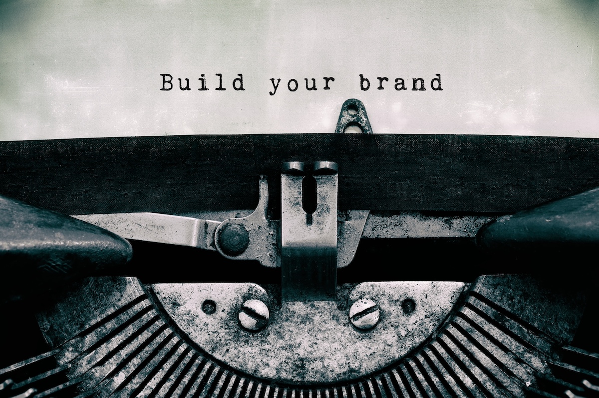 A vintage typewriter typing the words Build your brand